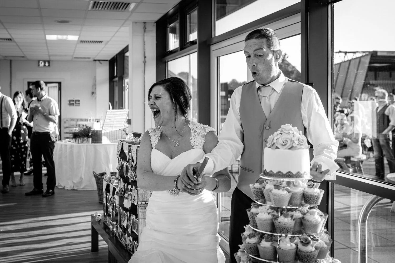 Bride and groom cutting cake