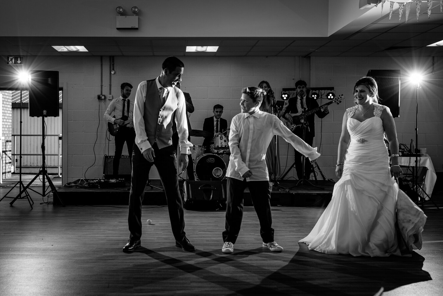 Bride, son and groom dancing