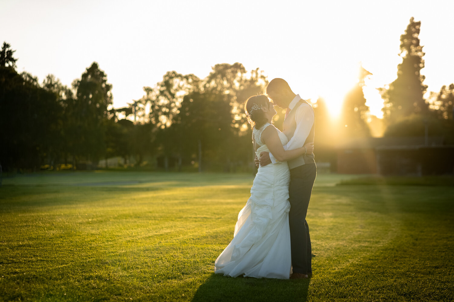 Sunset portrait of bride and groom at Royal Welsh Showground