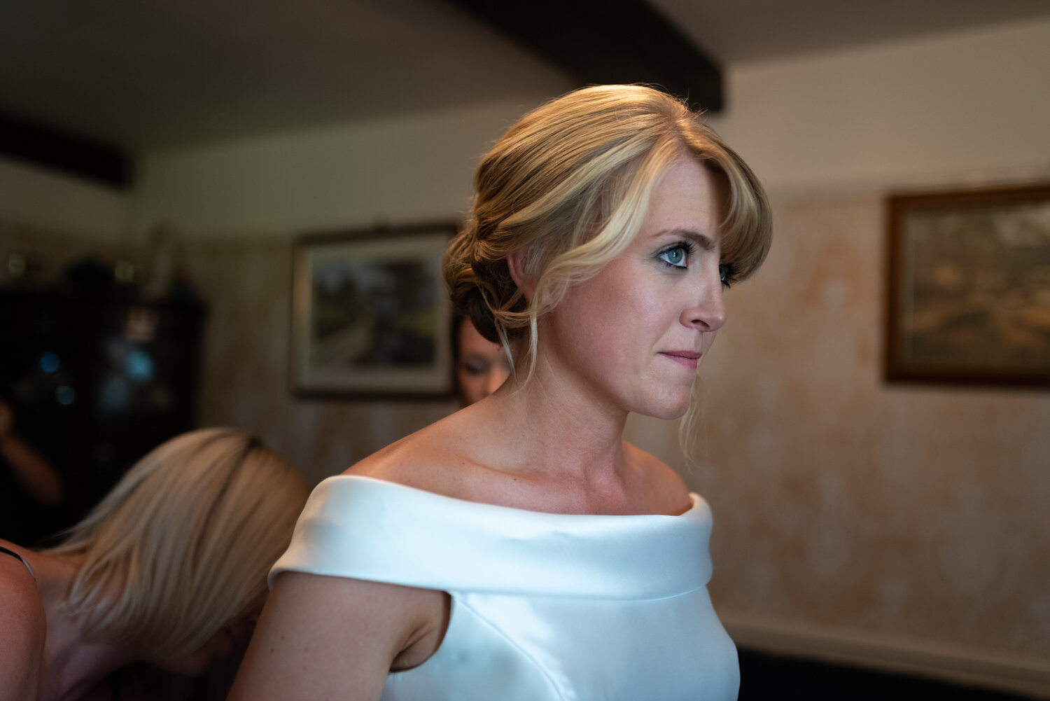 Bride whilst dress being altered