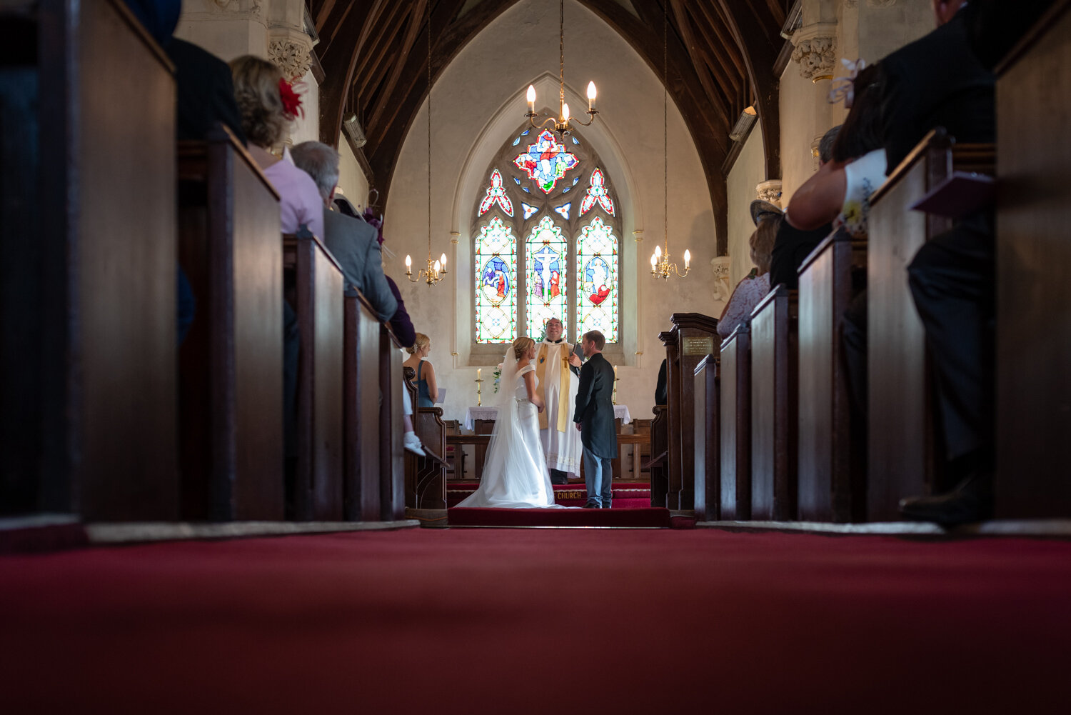 Bride and groom at altar during Powys wedding