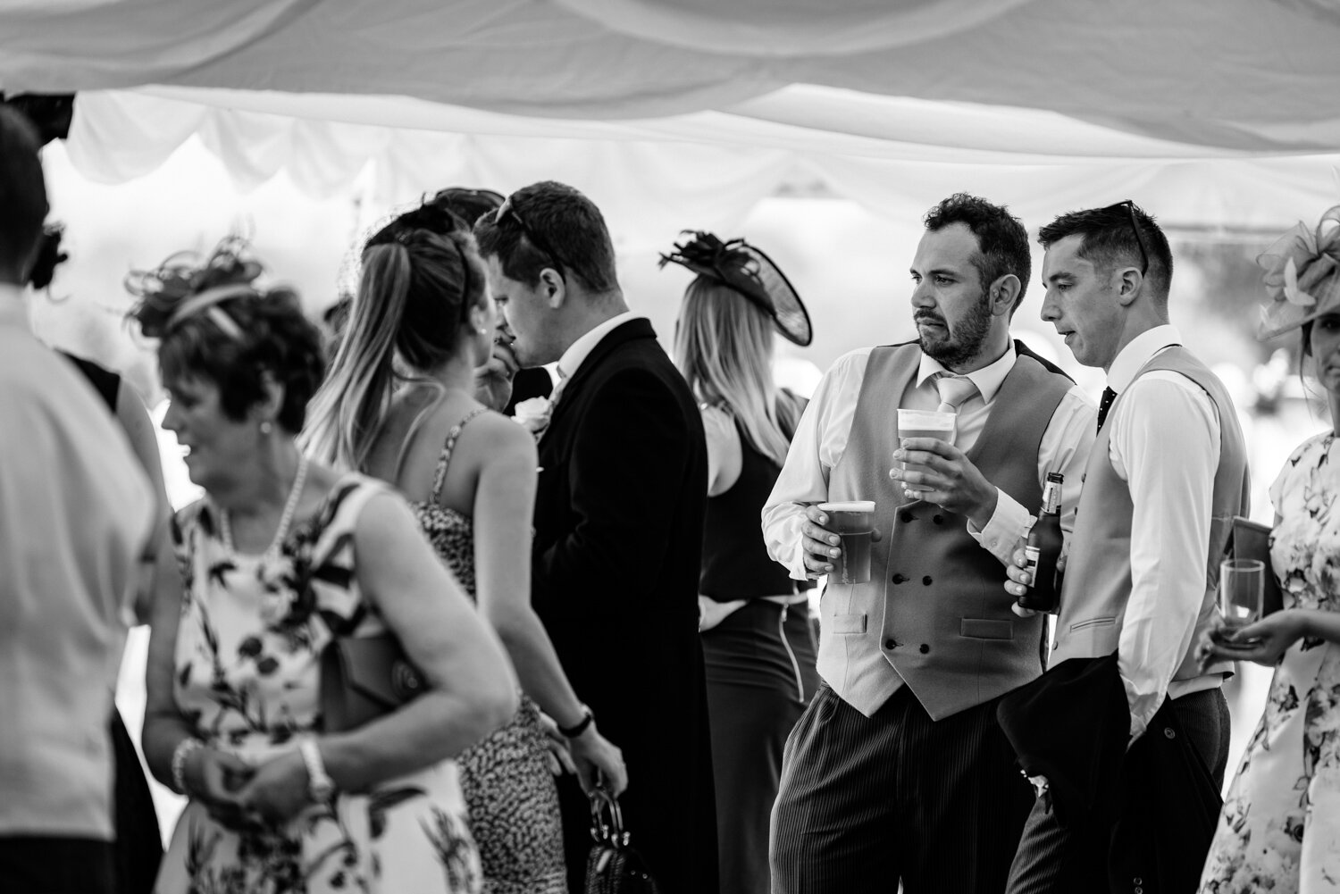 Wedding guests looking at table plan