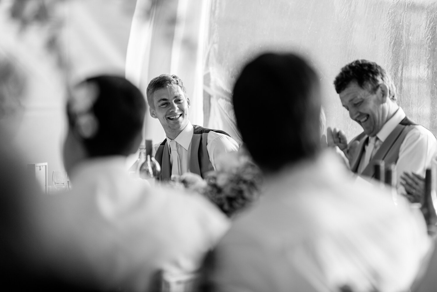 Best man smiling at Powys wedding