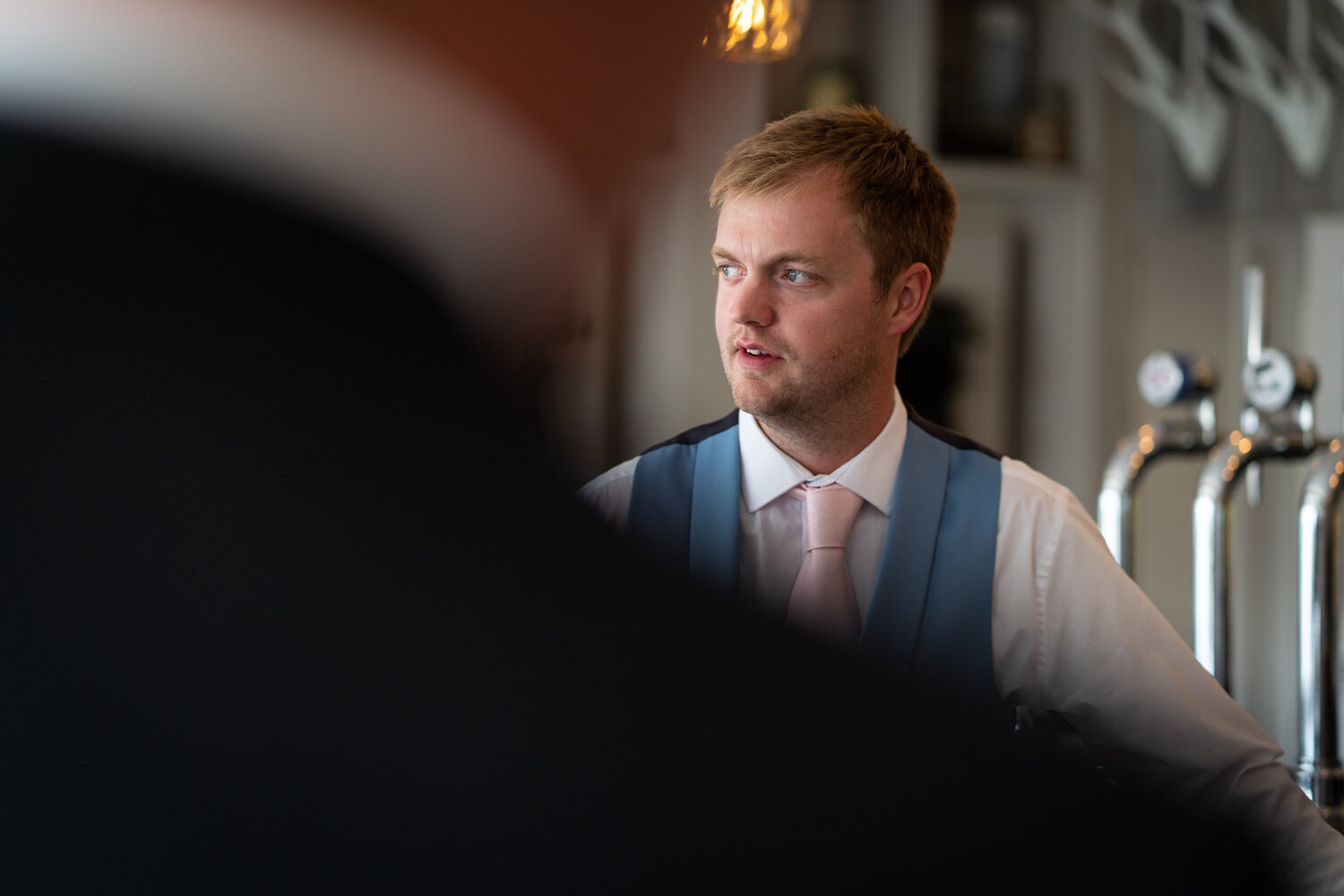 Groom stood at bar at Foyles of Glasbury