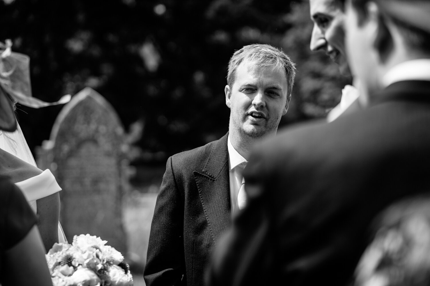 Groom in church yard after wedding ceremony