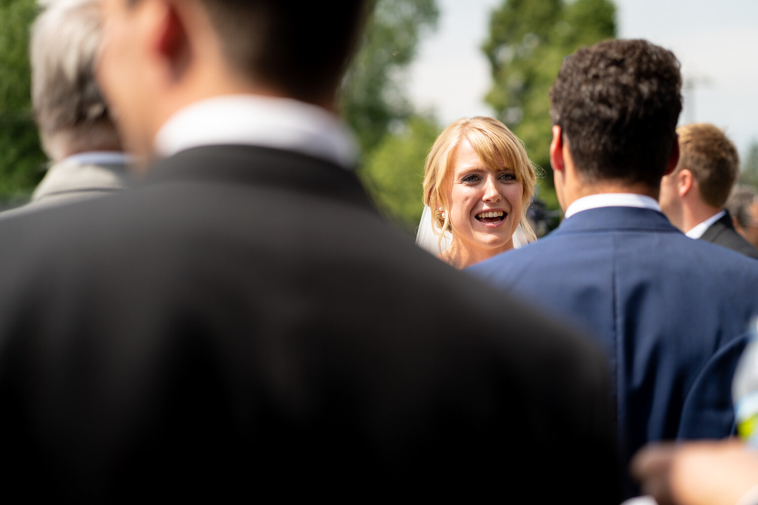 Bride talking to guests after wedding ceremony