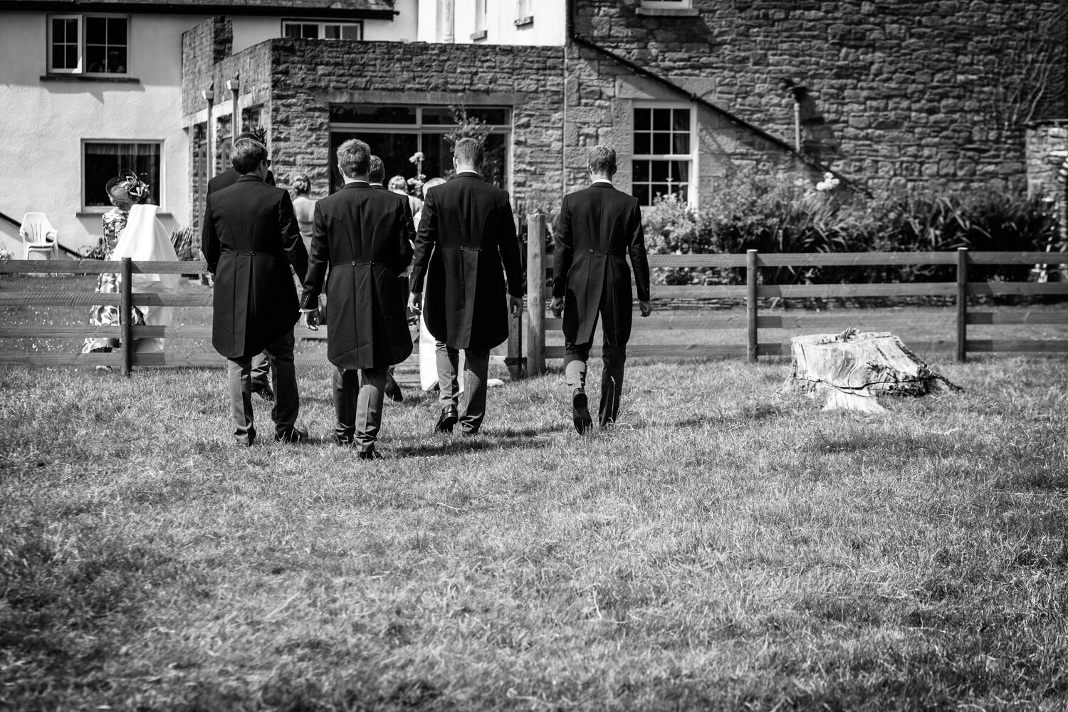 Groom and groomsmen walking away