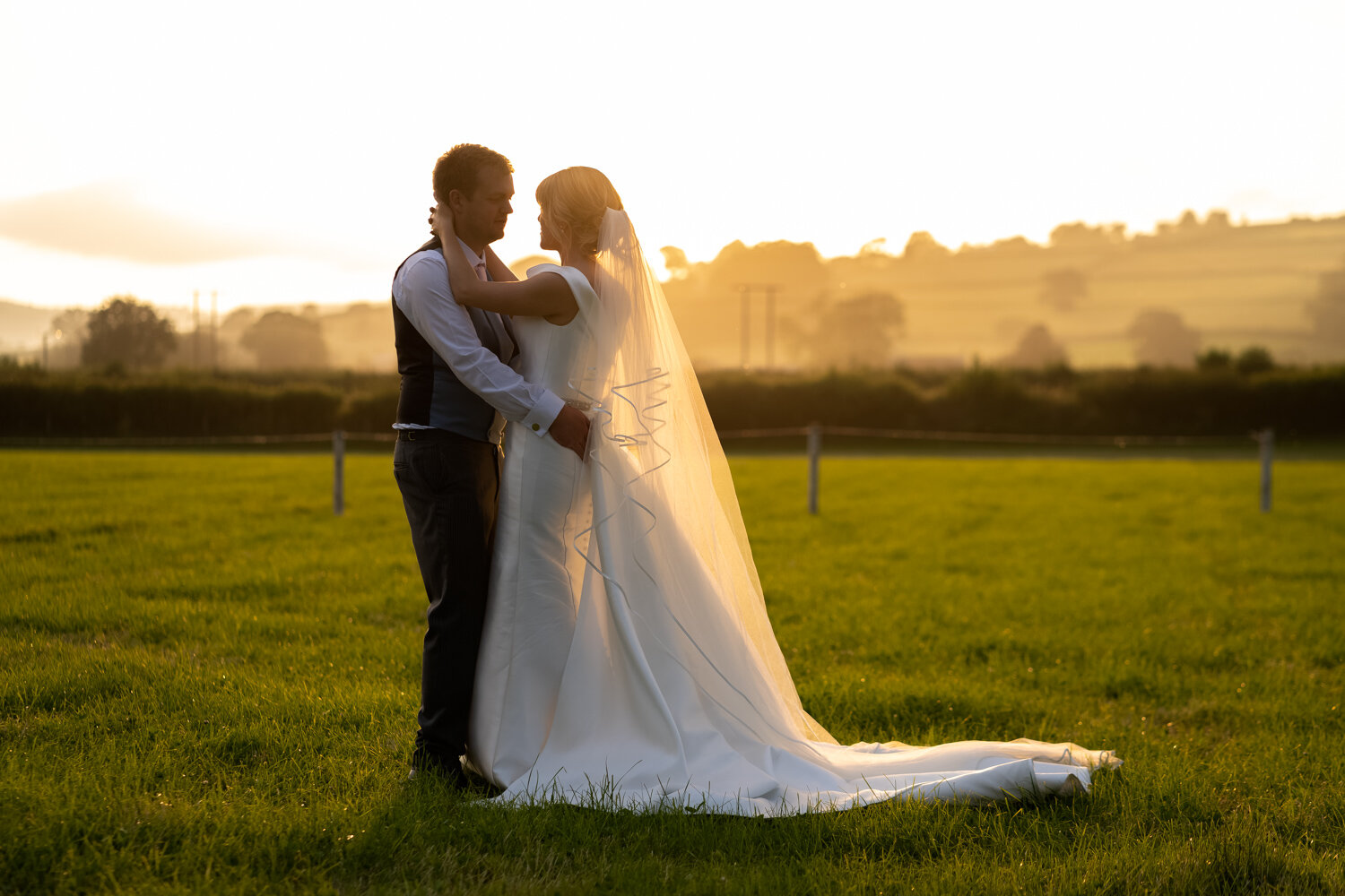Bride and groom during golden hour at Powys wedding