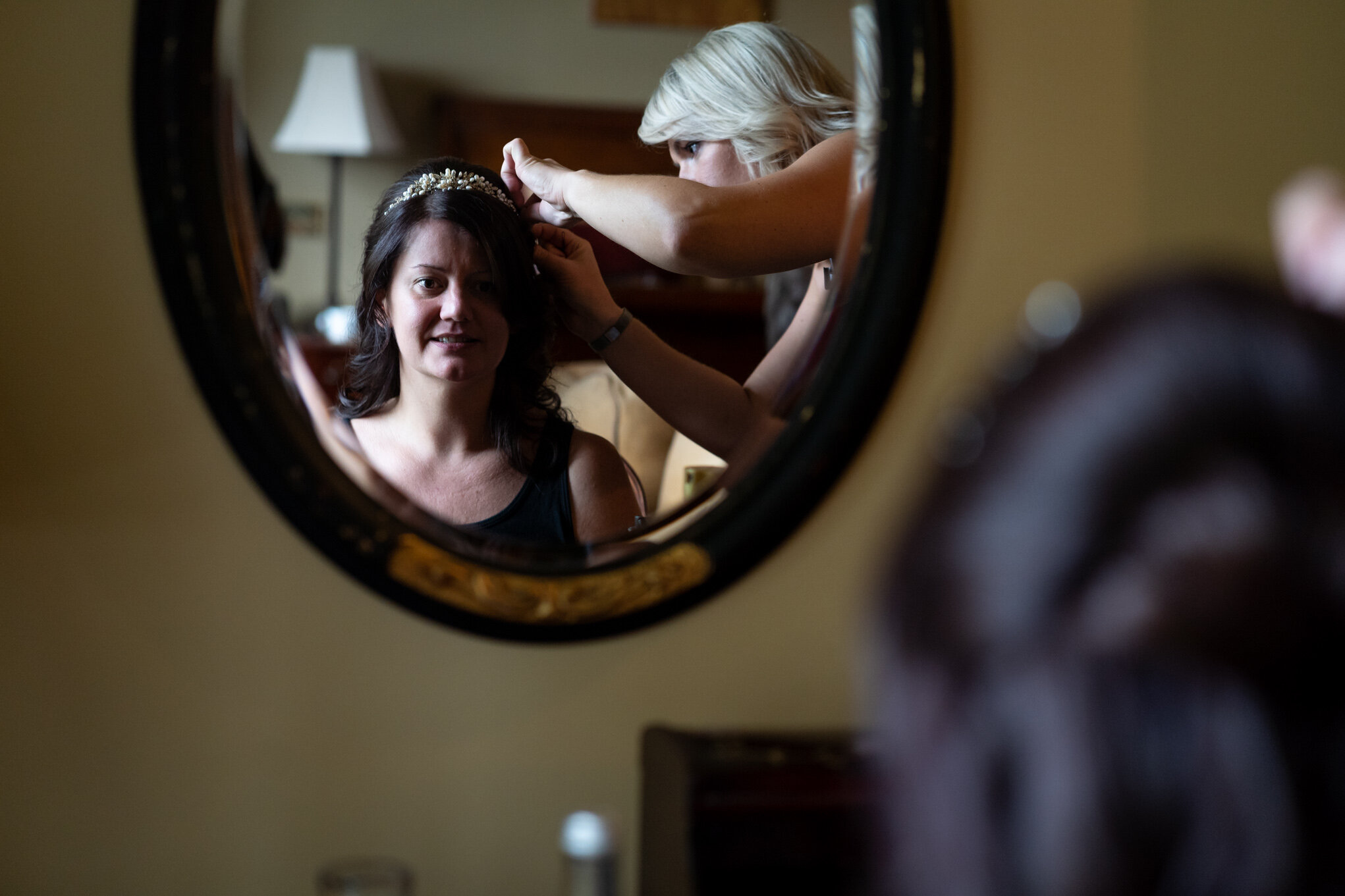 Bride having hair done at Peterstone Court