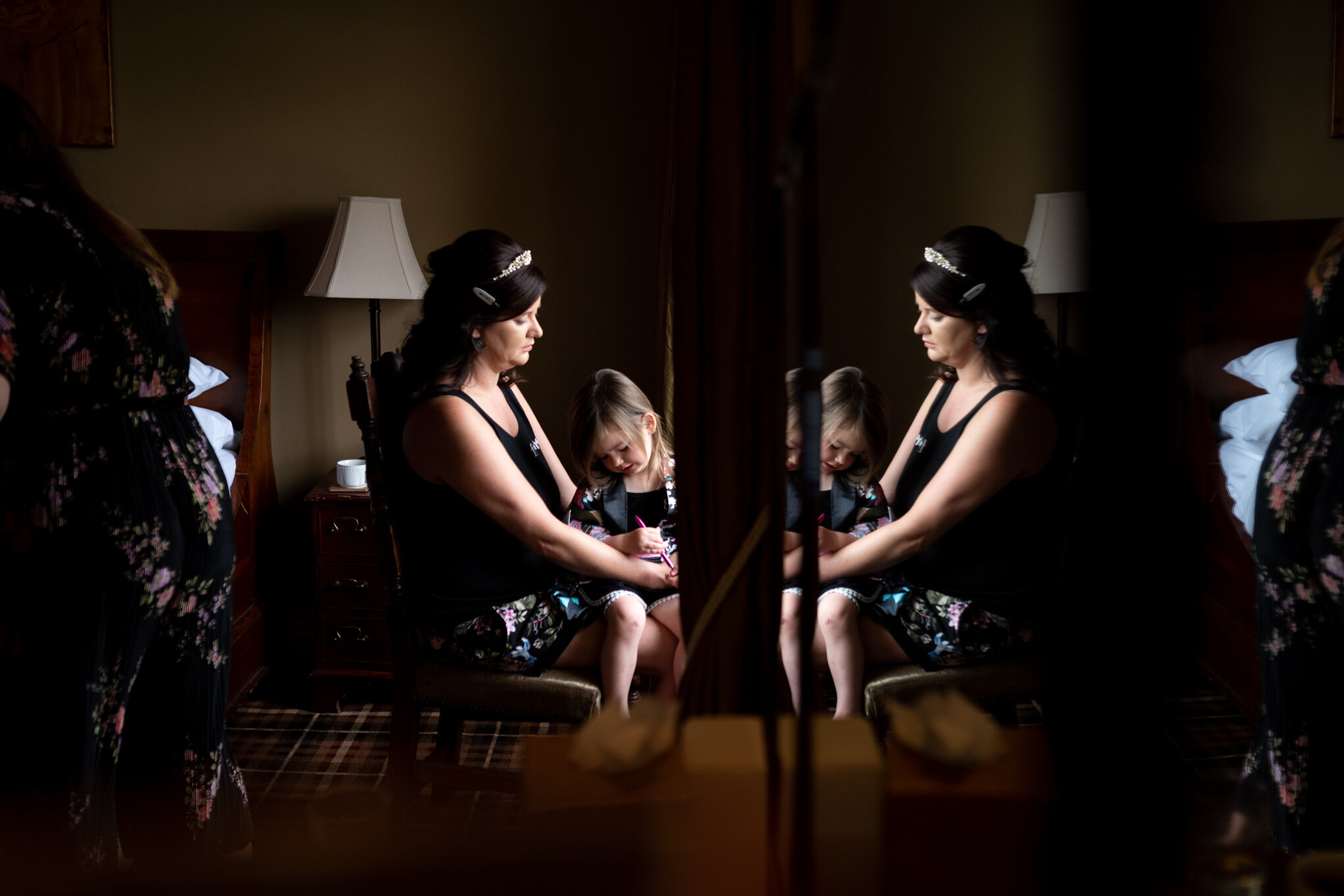 Reflection of bride having make-up done