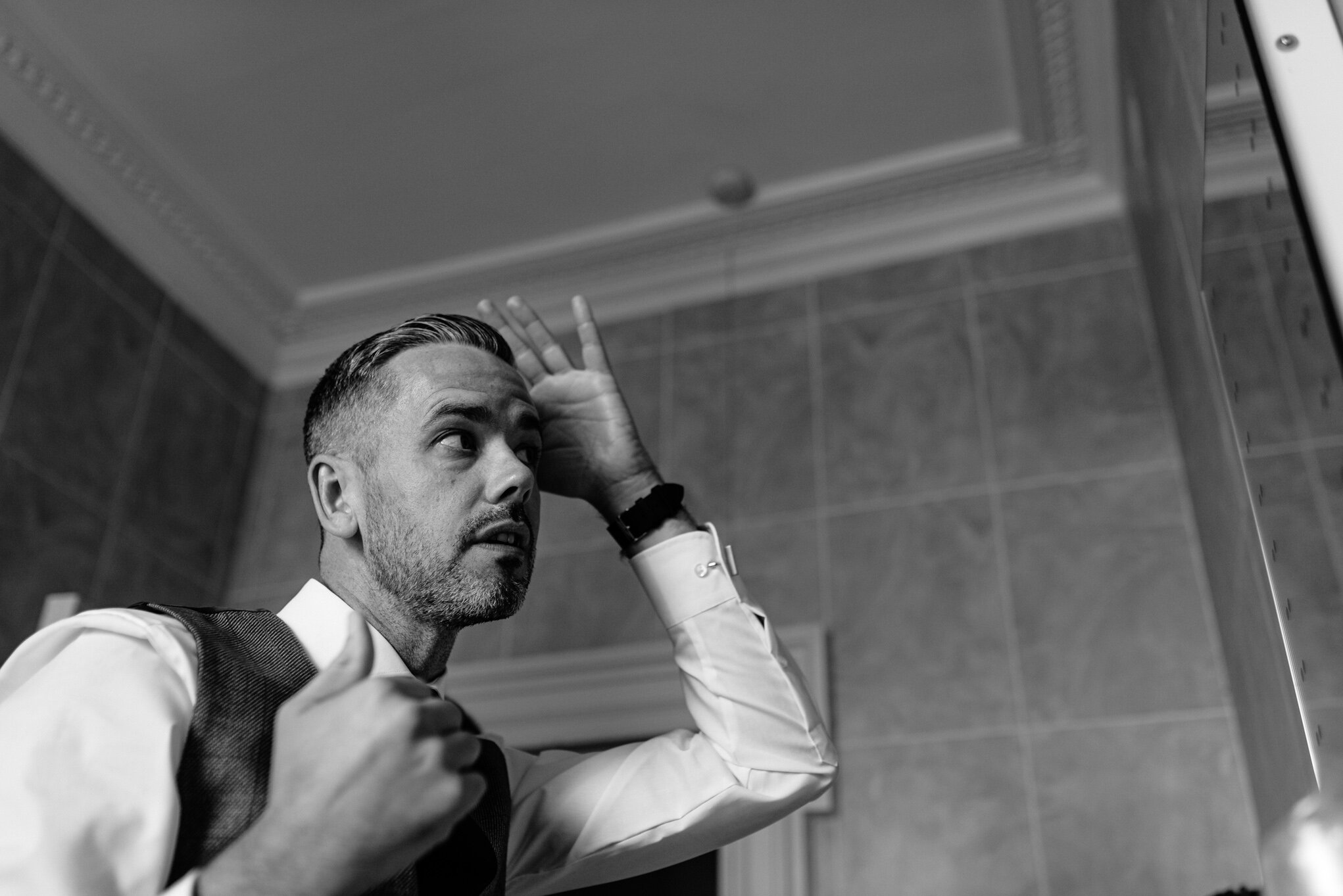 Groom styling his hair