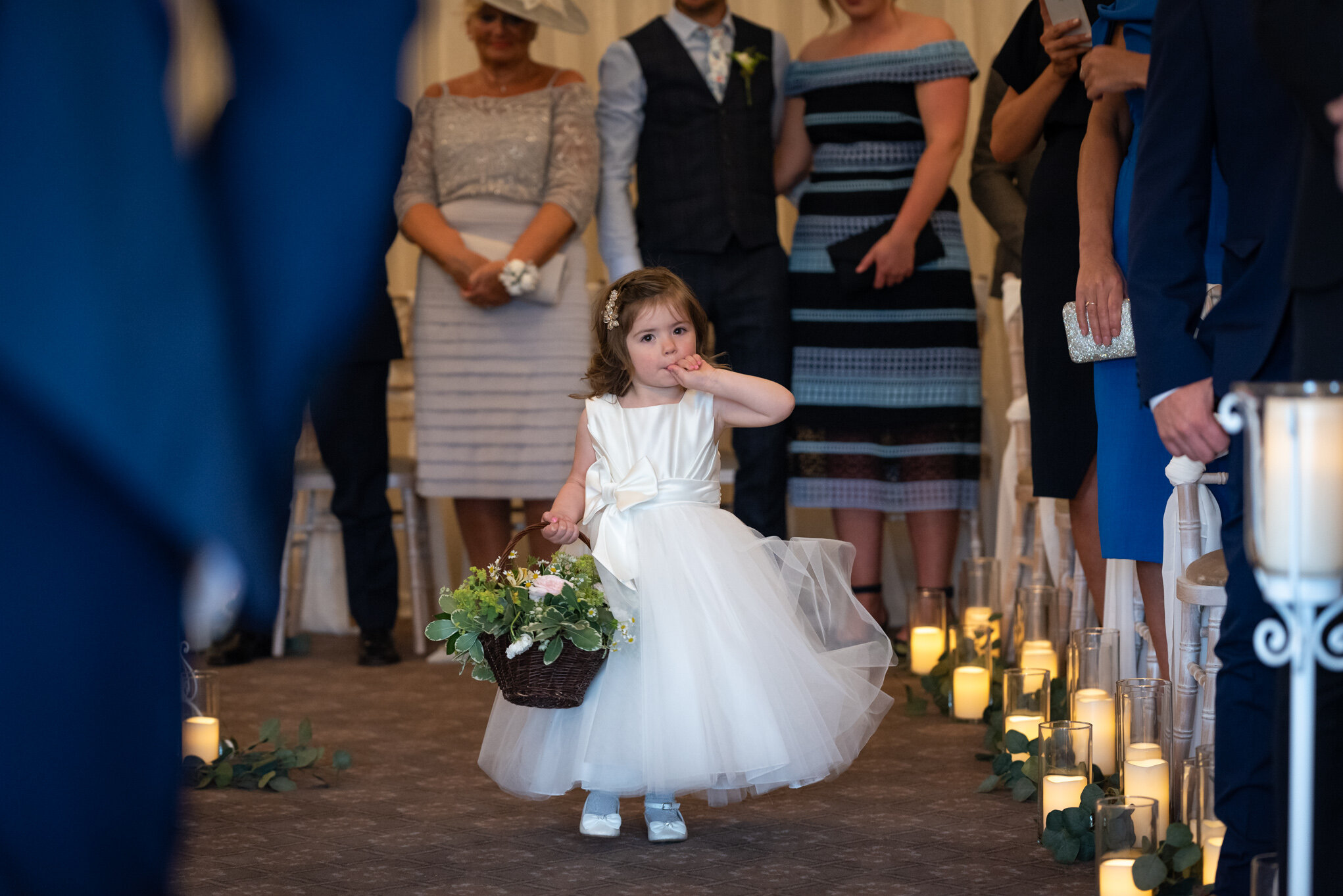 Flower girl walking down the aisle