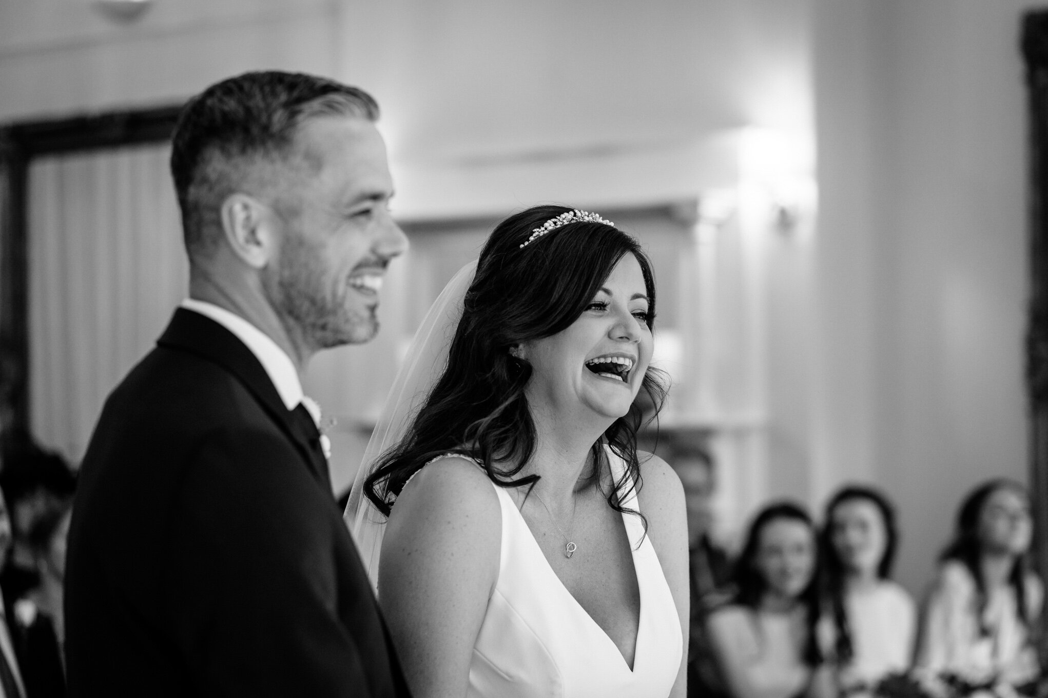 Bride &amp; groom laughing at Peterstone Court