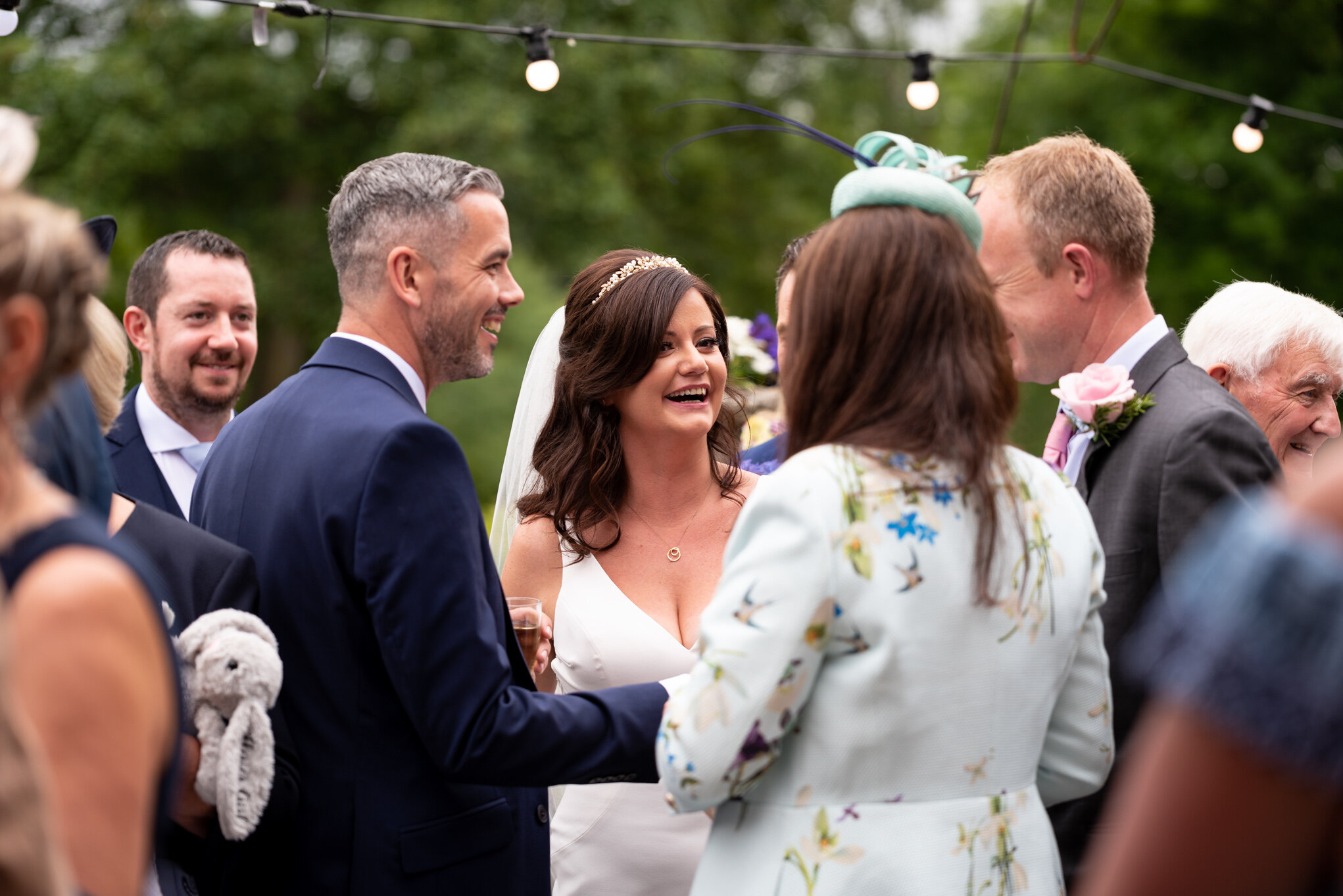 Bride laughing during Peterstone Court wedding reception