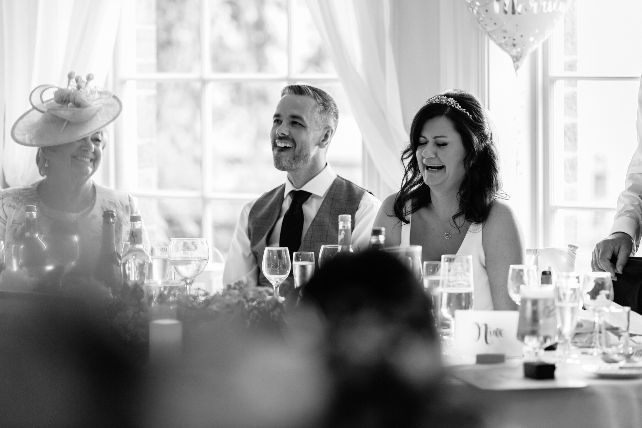 Laughter of bride and groom at Peterstone Court