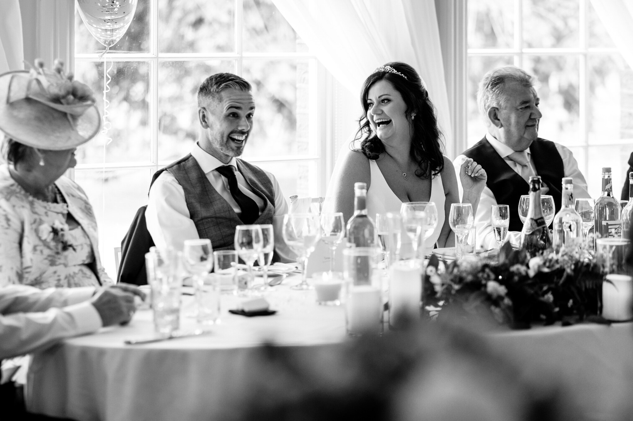 Groom and bride laughing