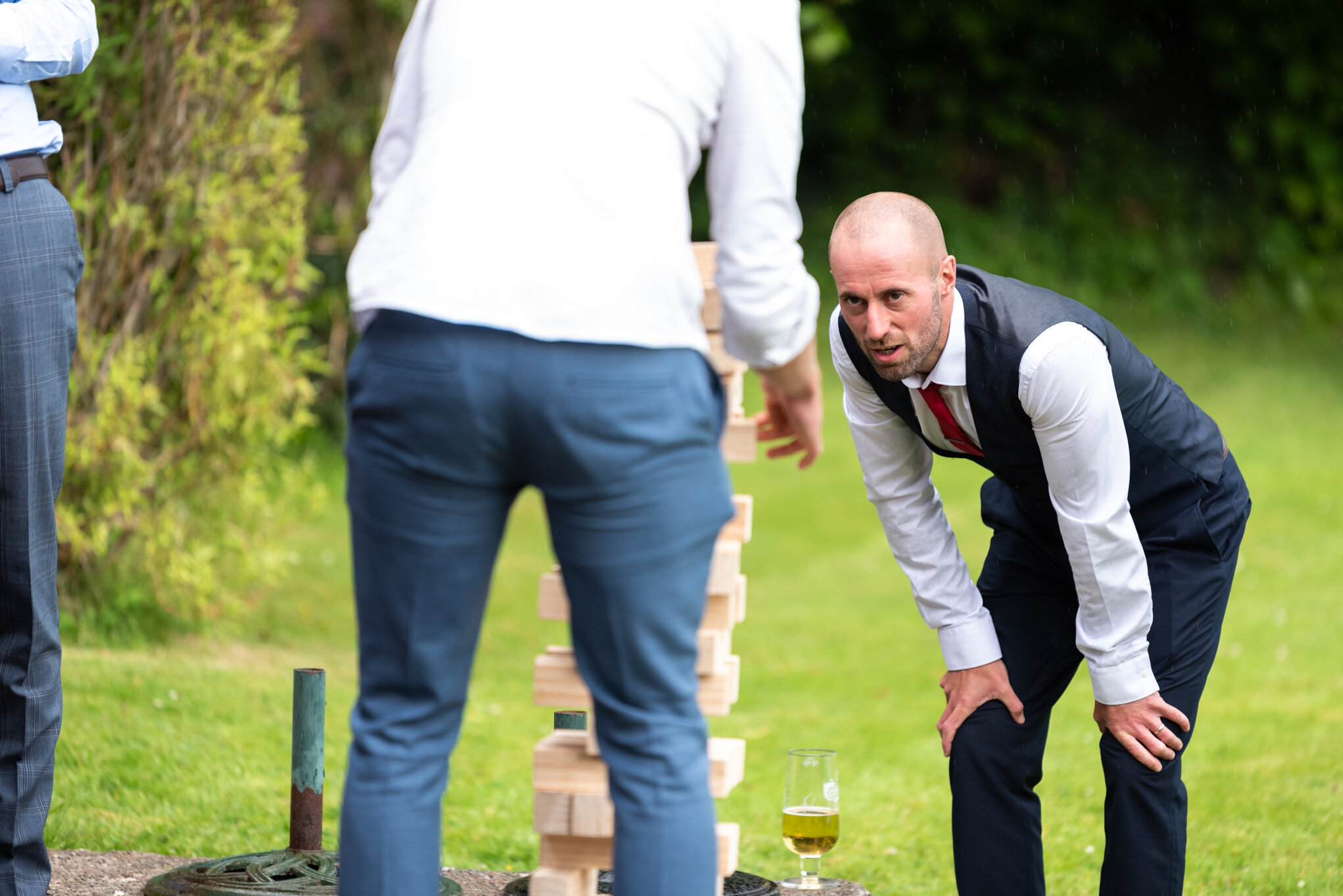 Wedding guests studying game at Peterstone Court