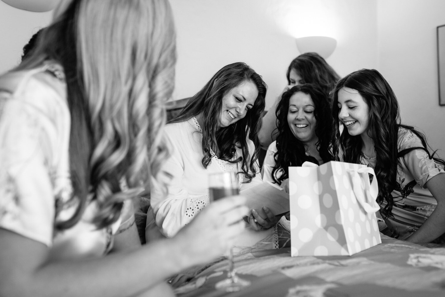 Bridesmaids and bride laughing at Tall John's House