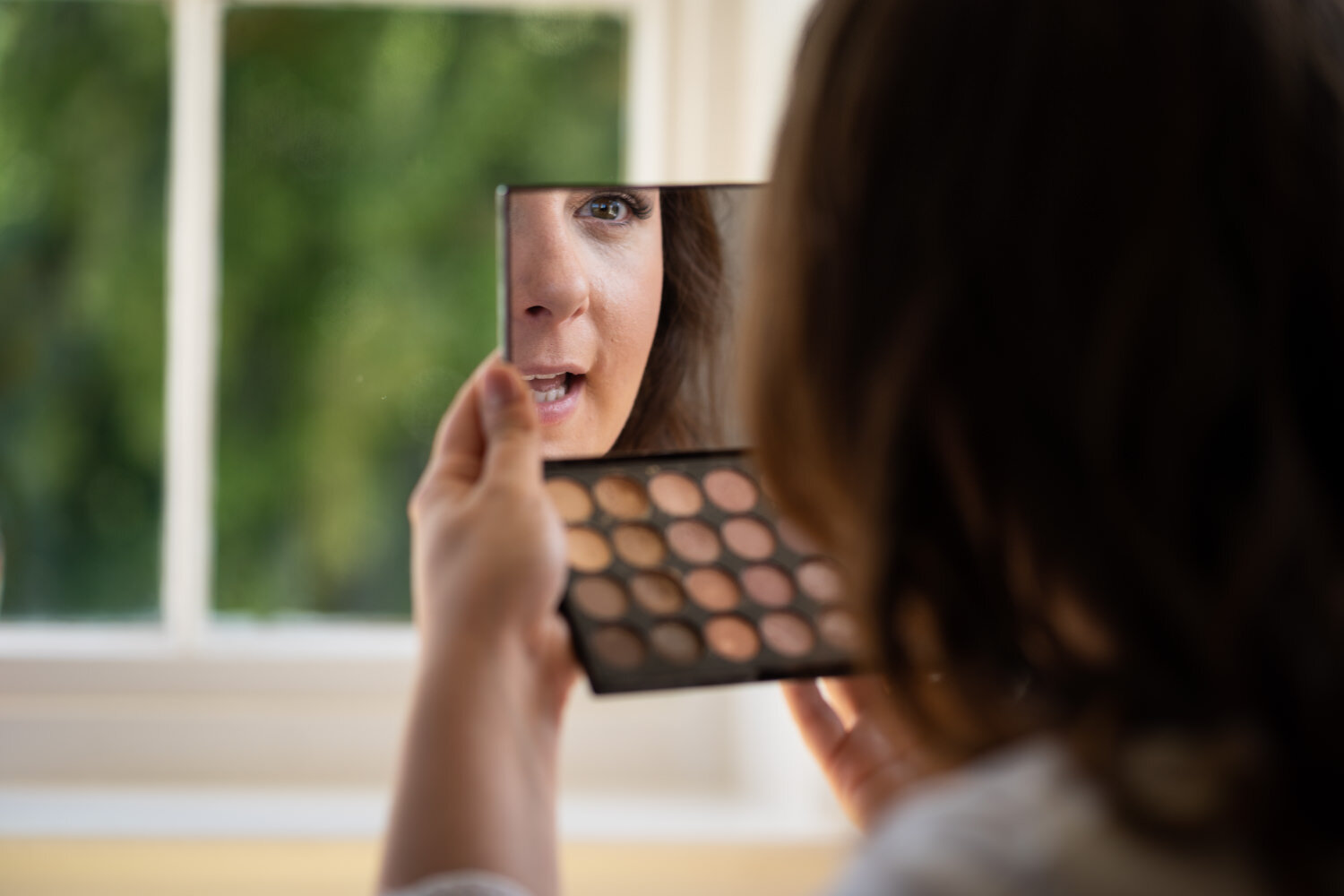 Bride doing make-up