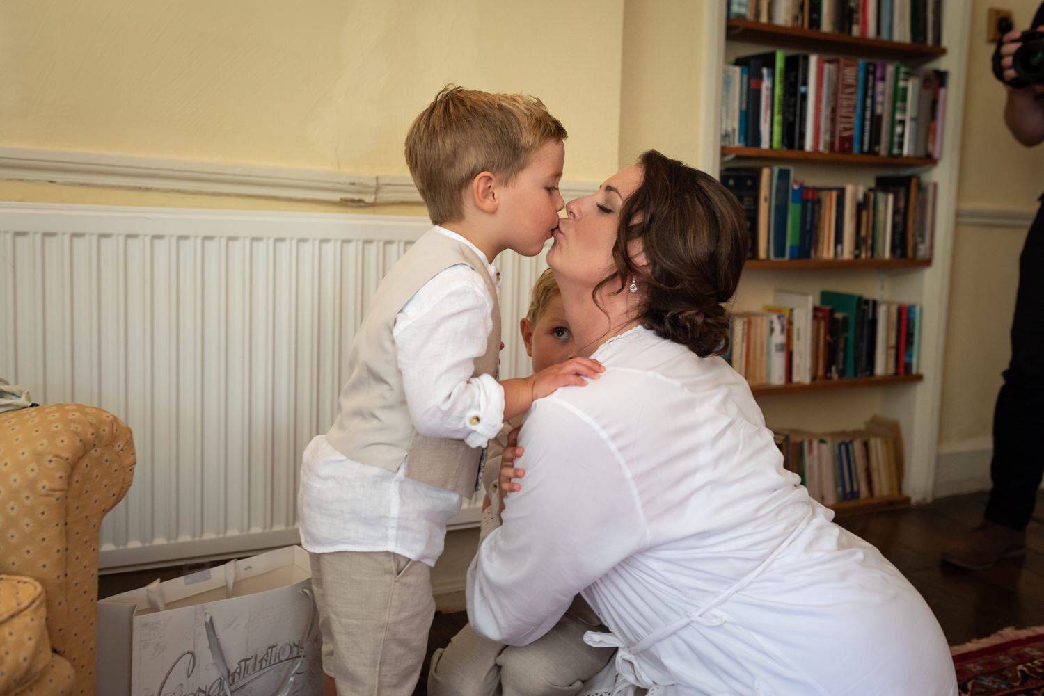 Bride kissing paige boy