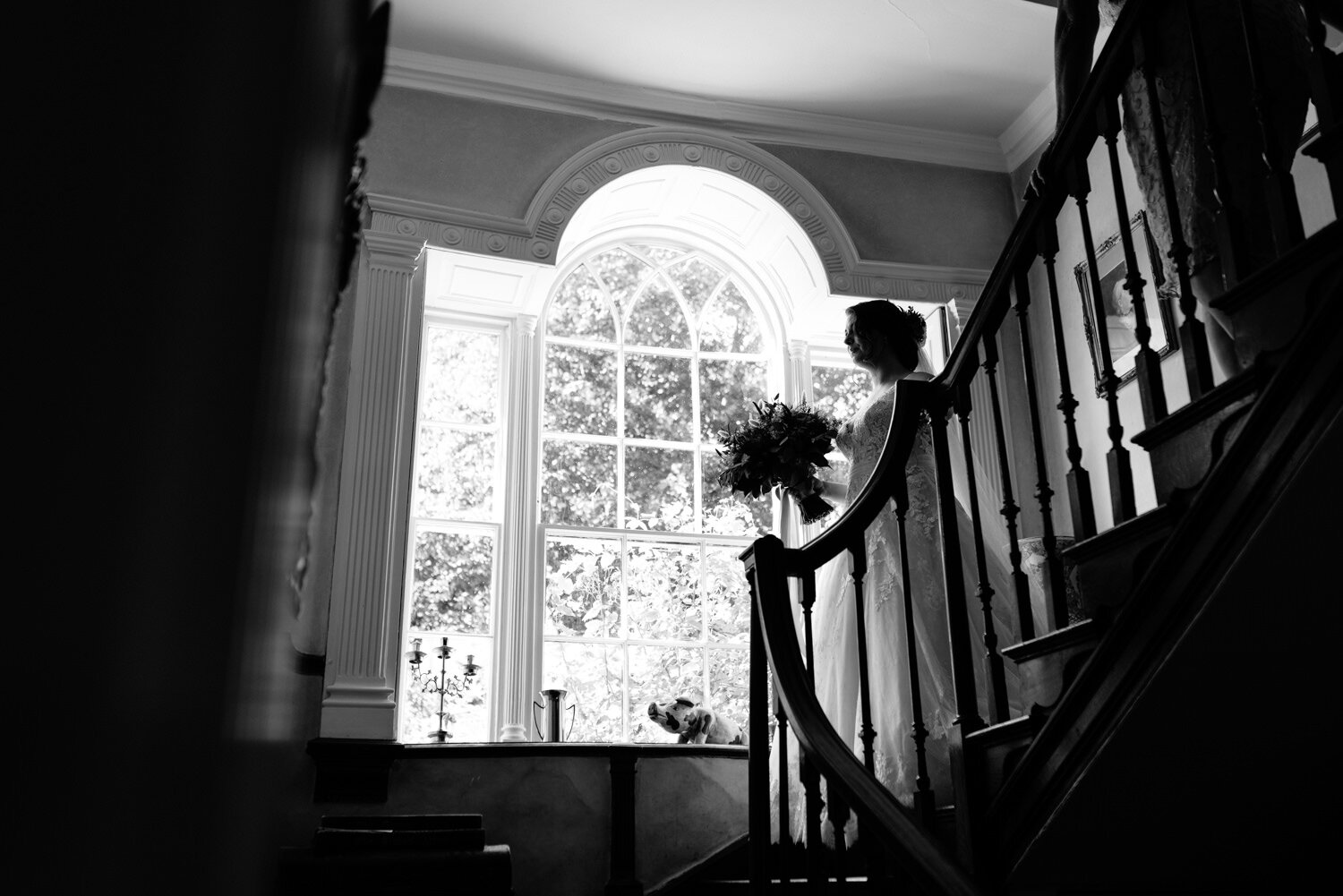 Bride walking down the stairs at Tall John's House wedding
