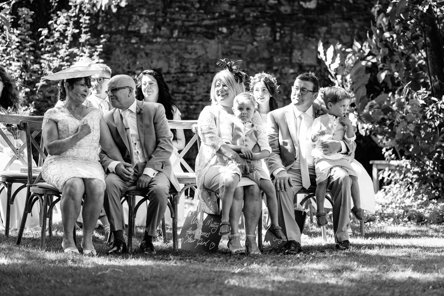 Guests during wedding ceremony at Tall John's House