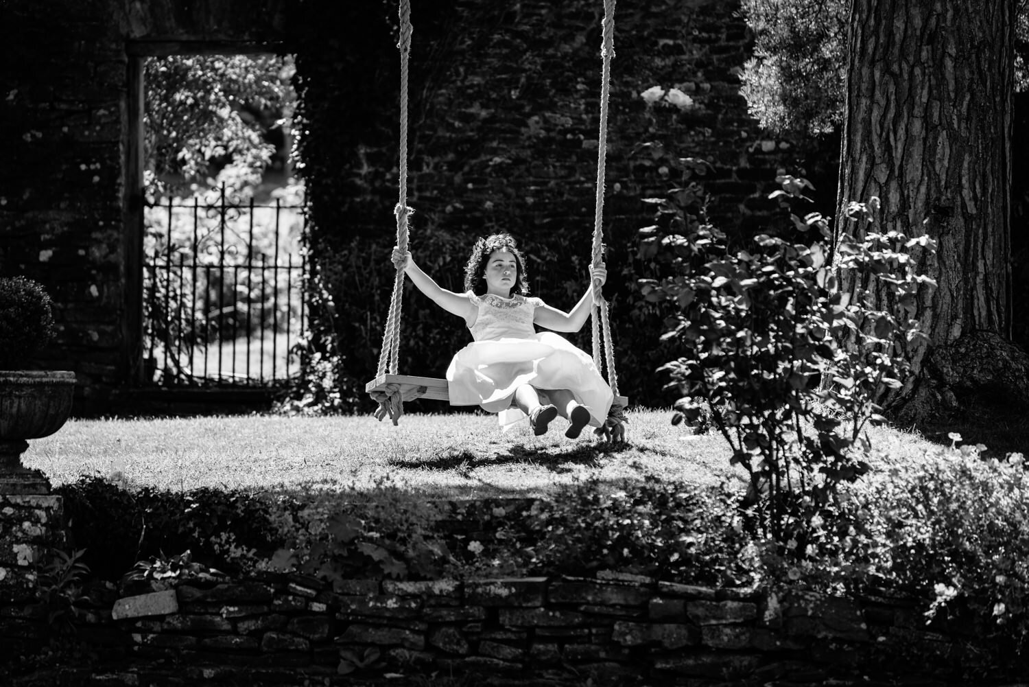 Young girl on swing at Tall John's House wedding