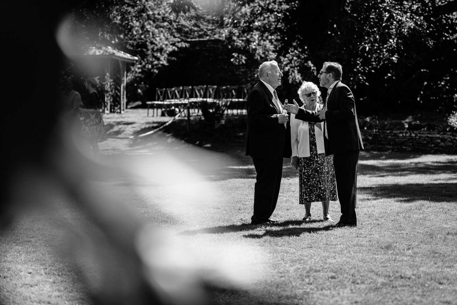 Older guests talking at Tall John's House wedding reception