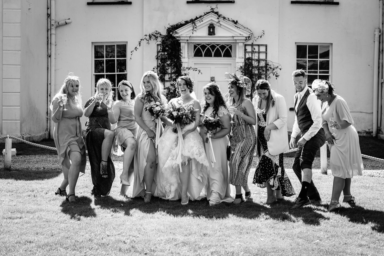 Bridal party laughing at Tall John's House wedding