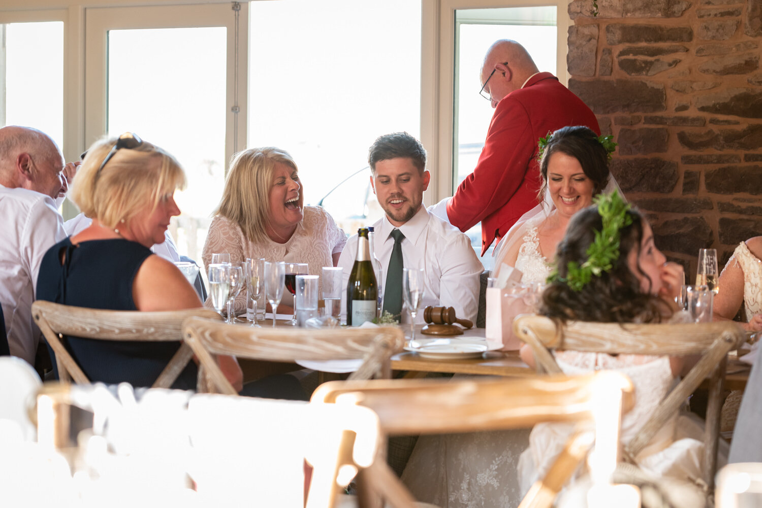 Laughter during Tall John's House wedding speeches