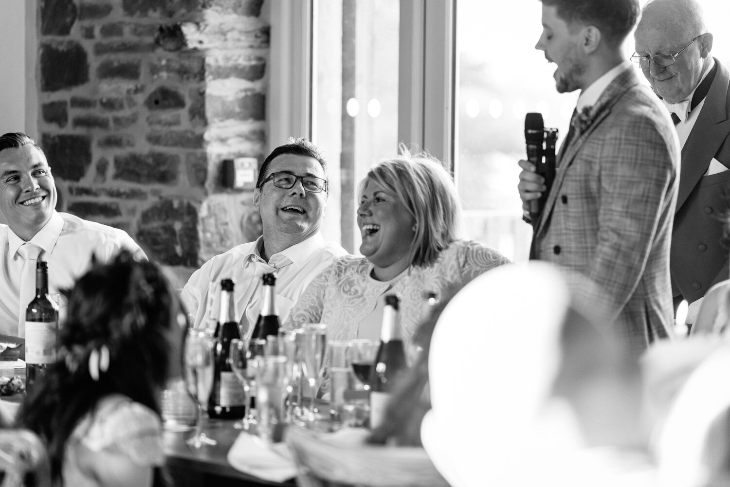 Laughter during Tall John's House wedding speeches