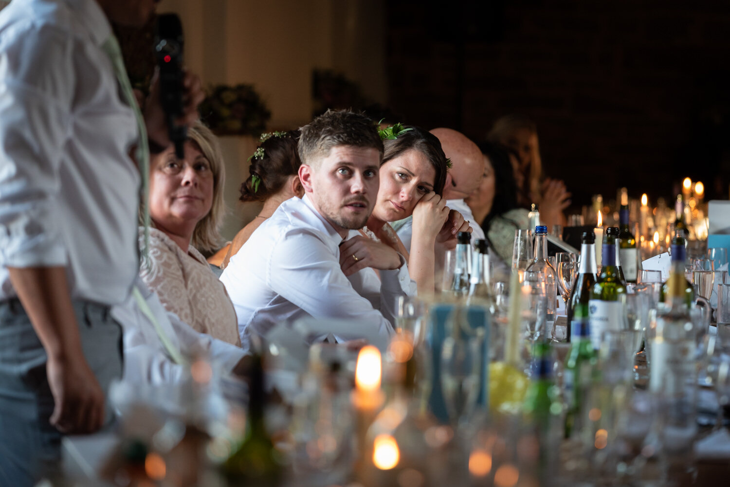 Groom looking worried during best man speech