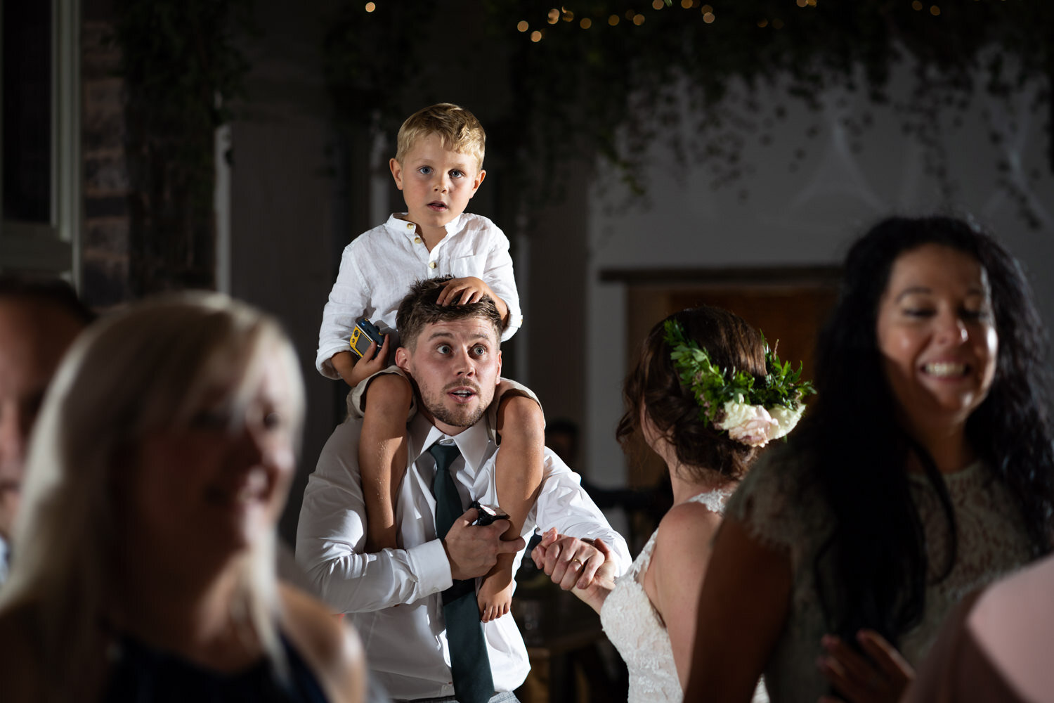 Groom with paige boy on shoulders at Tall John's House