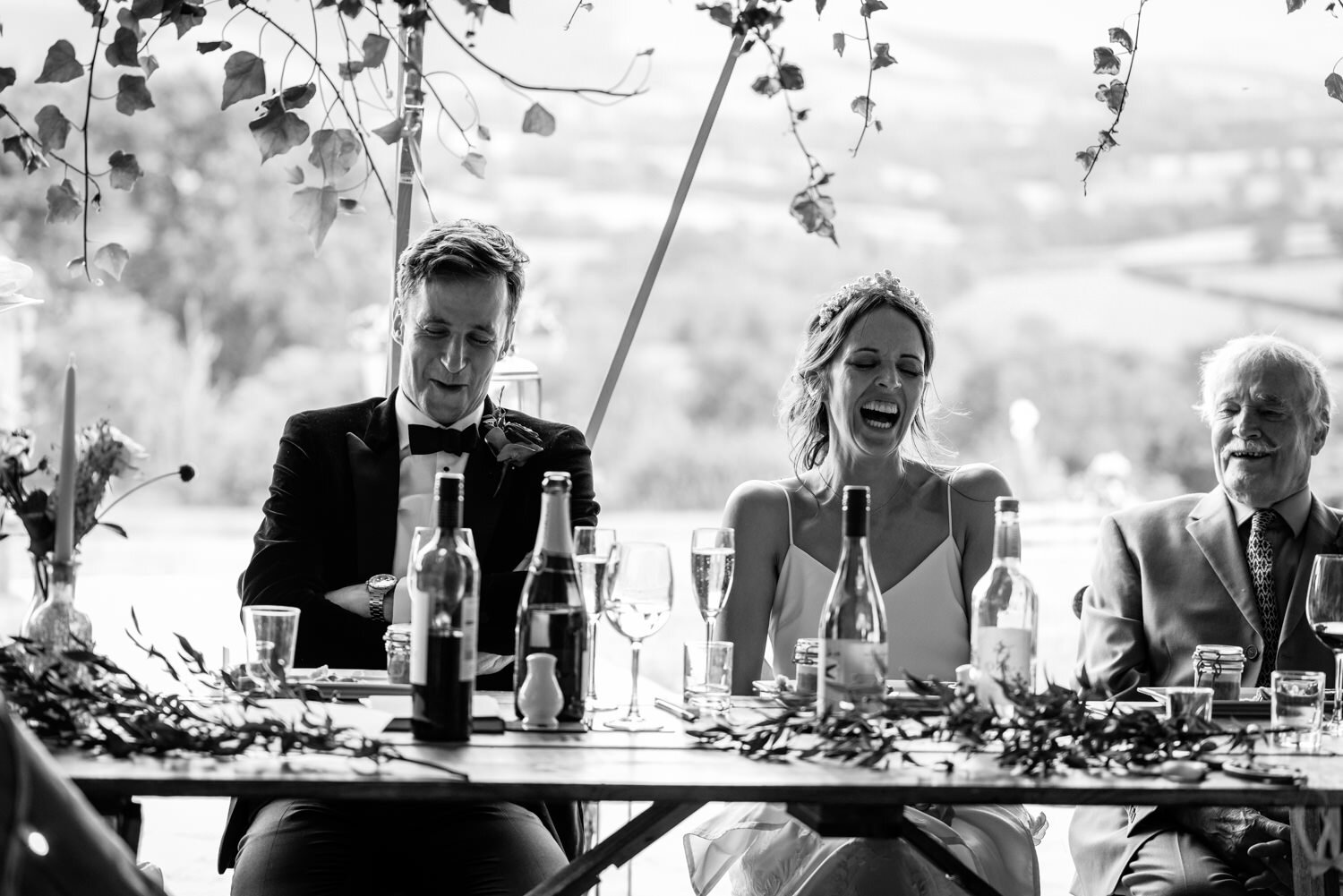 Laughter from bride &amp; groom during wedding speeches