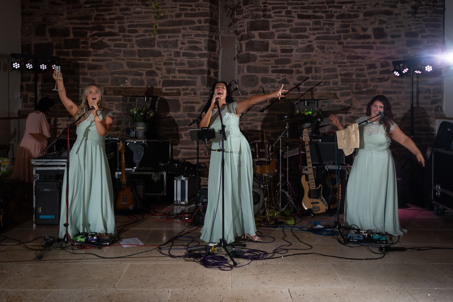 Bridesmaids playing with the band