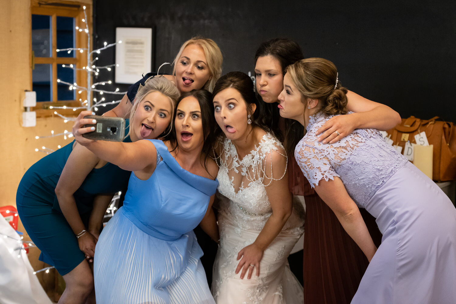 Funny faces from bride and friends at Glyngynwydd wedding