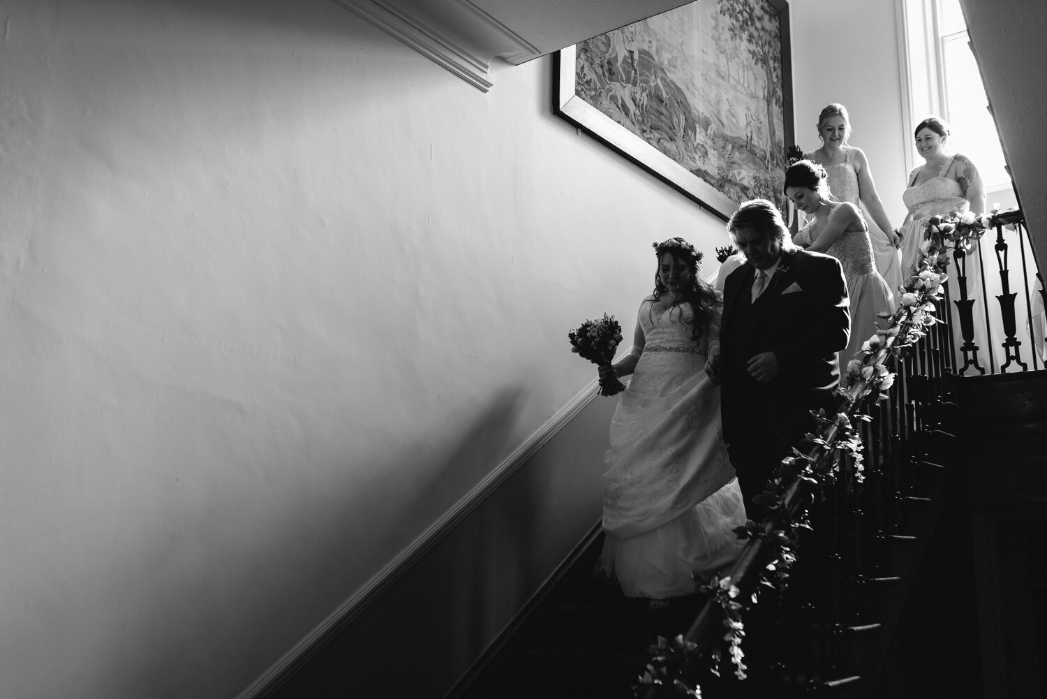 Bride walking down stairs at Brooks Country House