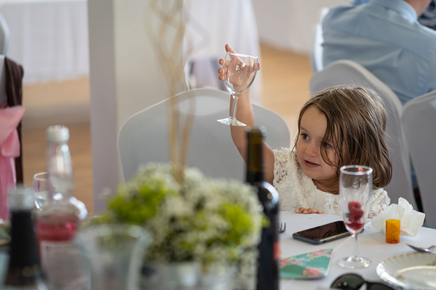 Young guest toasting with wine