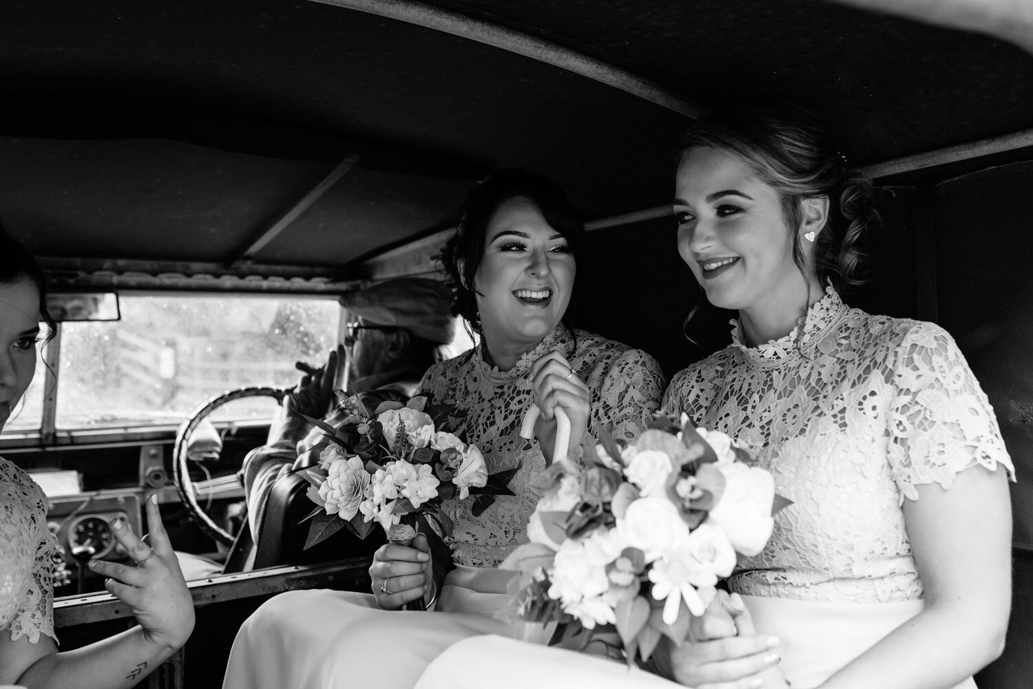 Bridesmaids in back of landrover