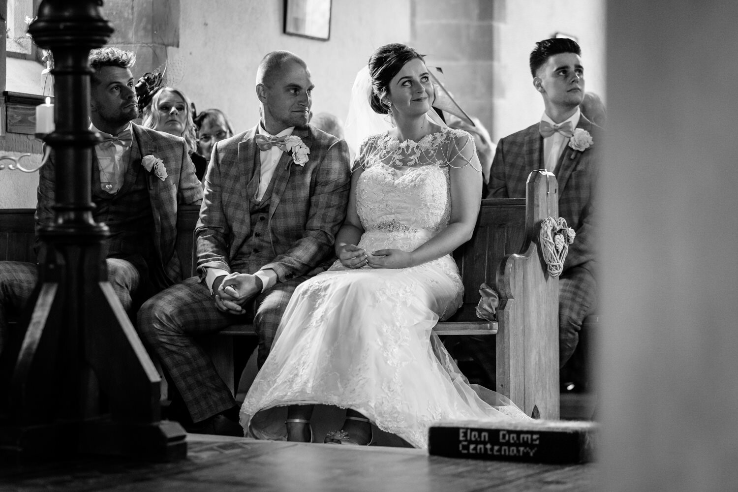 Groom looking at bride during wedding ceremony 