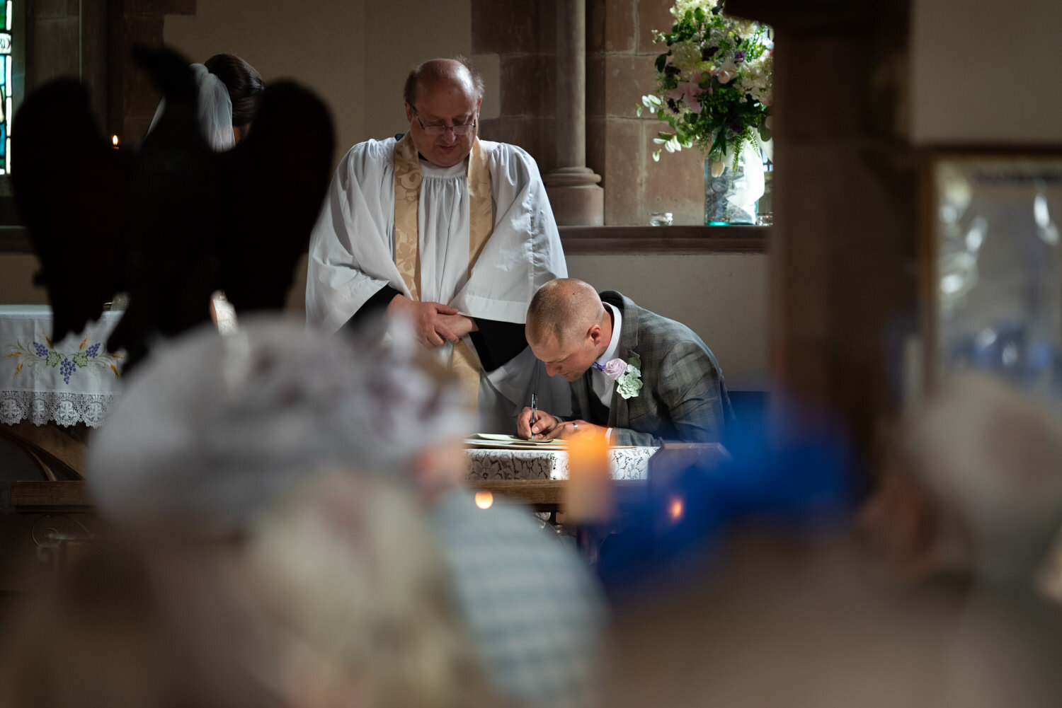 Groom signing wedding register