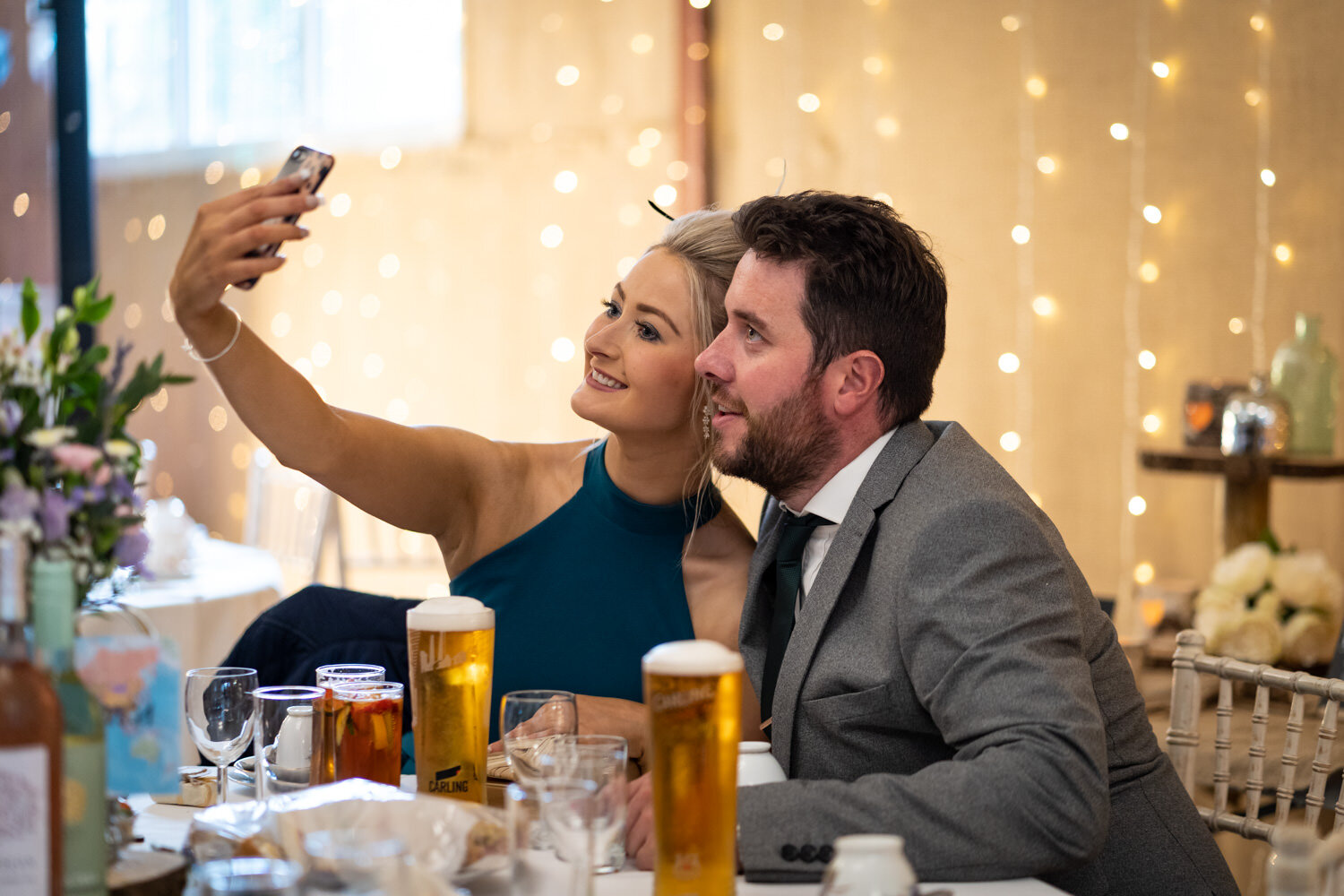 Selfie taking wedding guests at Glyngynwydd Wedding Barn