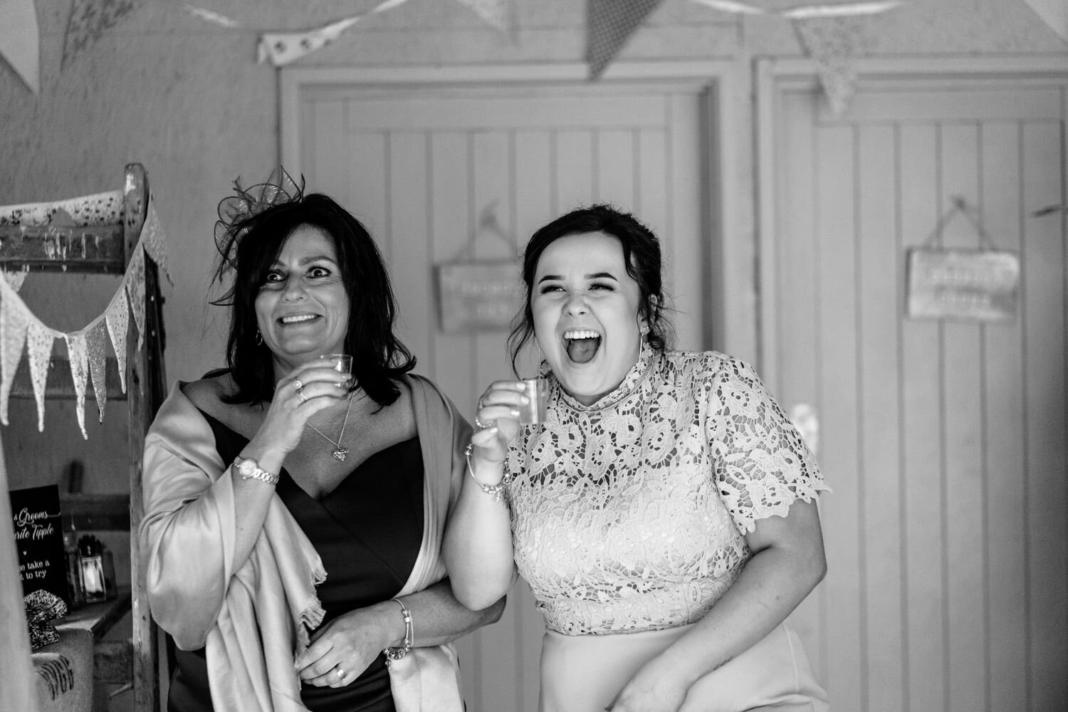 Laughing guests and bridesmaids at Powys wedding