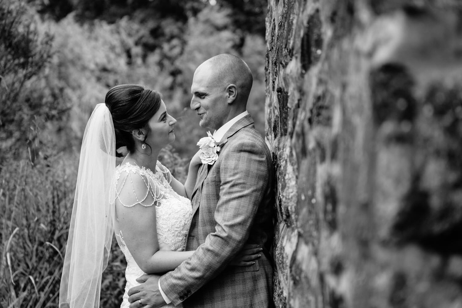 Bride and groom looking at each other at Glyngynwydd Wedding Barn