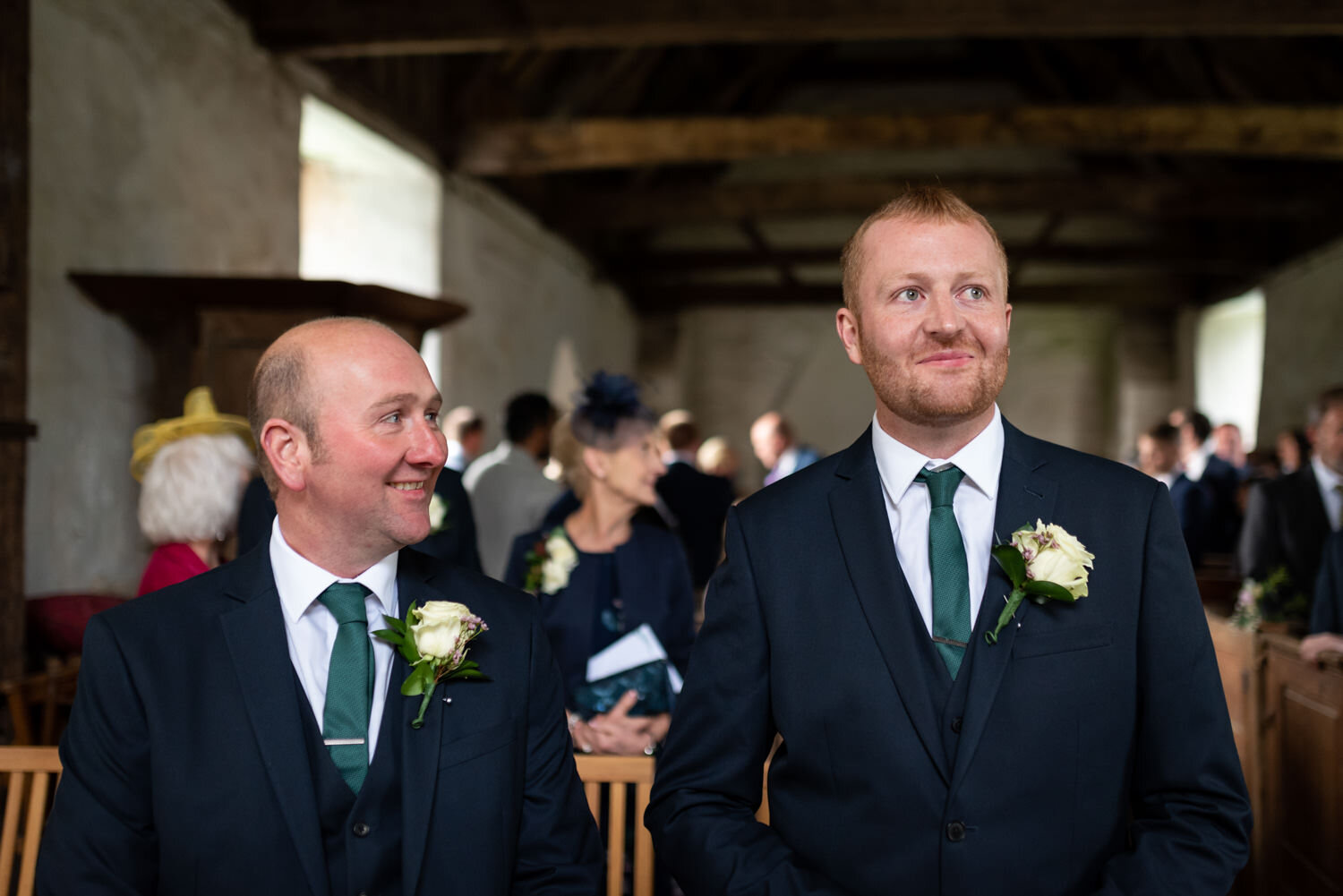 Groom and Best Man stood in Mid Wales church