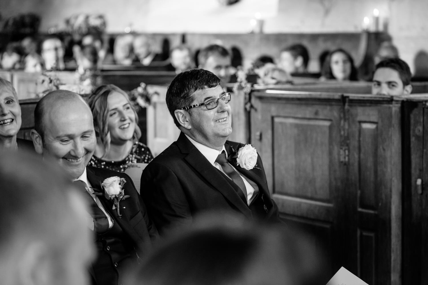 Father of bride laughing during Powys wedding ceremony
