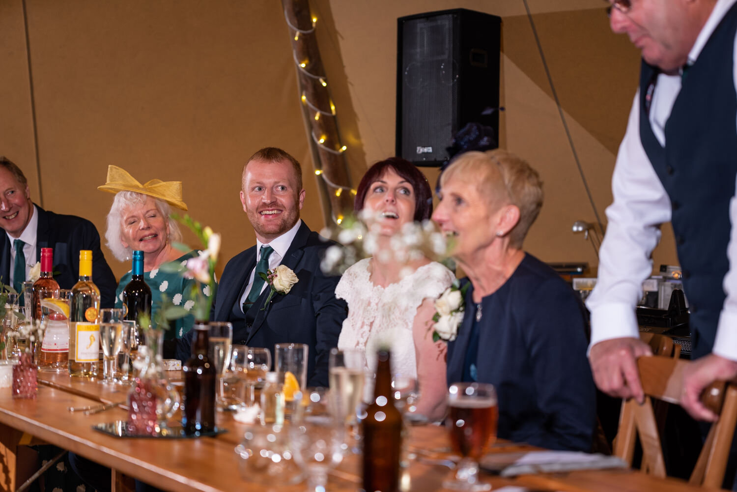 Groom laughing at speeches