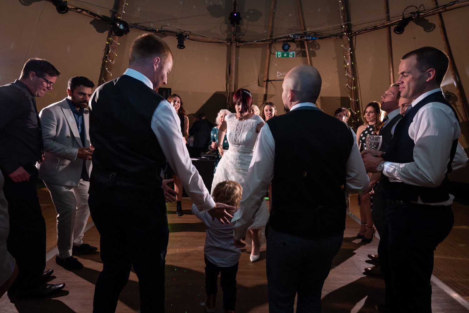 Bride dancing at wedding party in Mid Wales