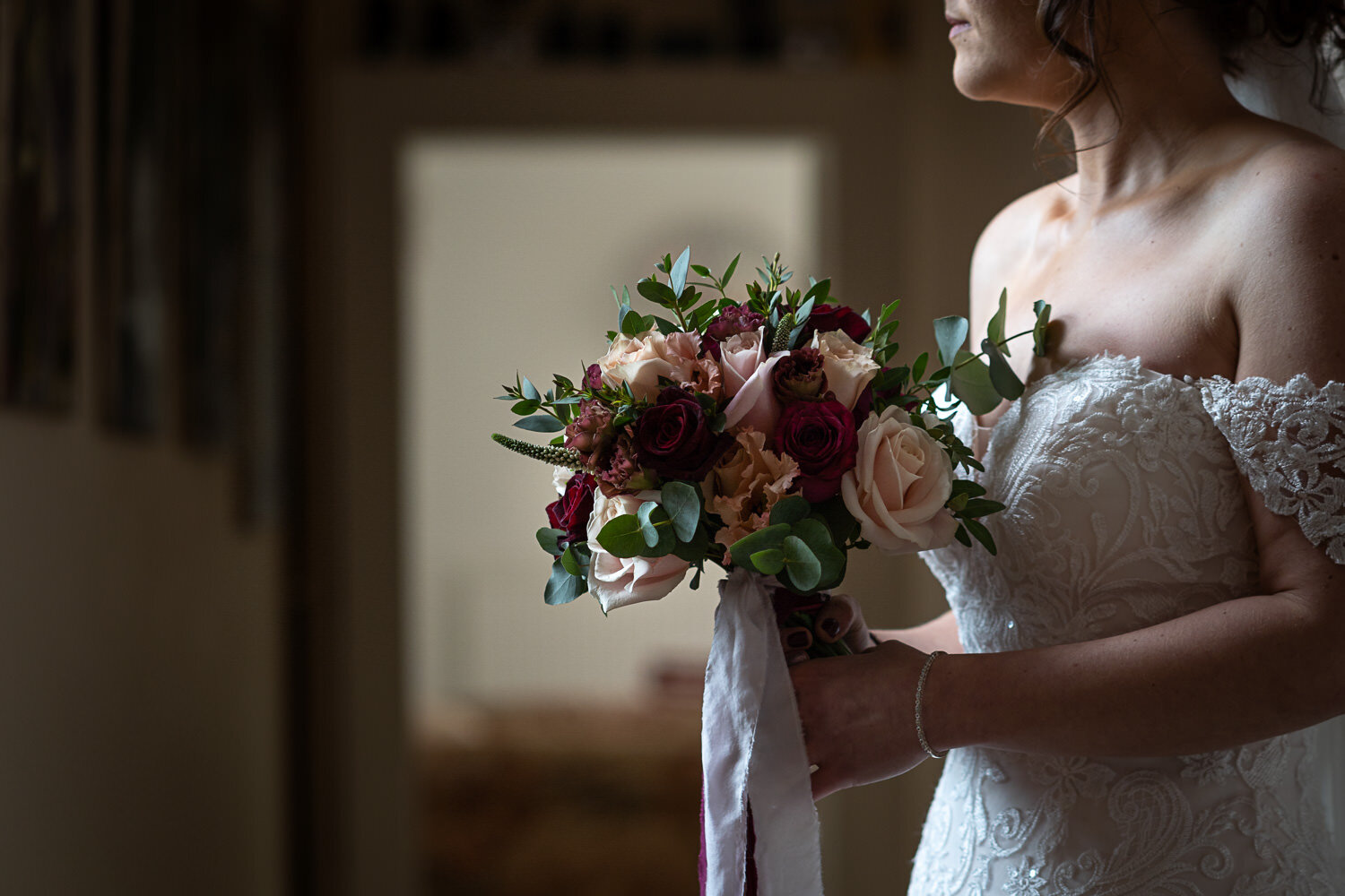 Bride holding bouquet at Lyde Court