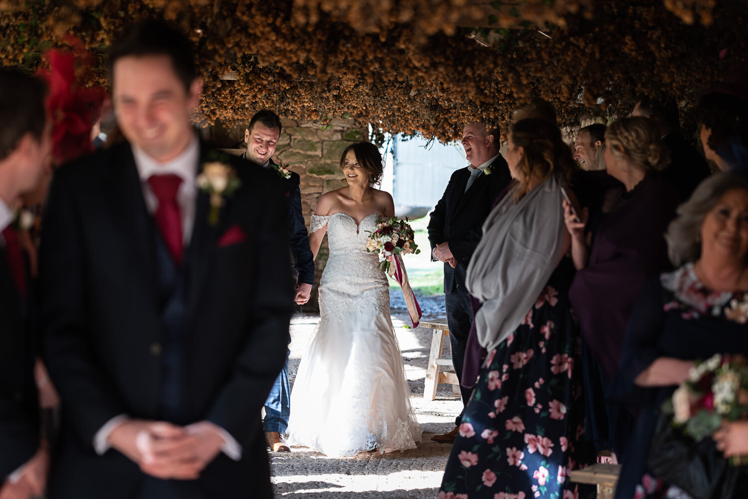 Bride  groom walking down aisle at Lyde Court